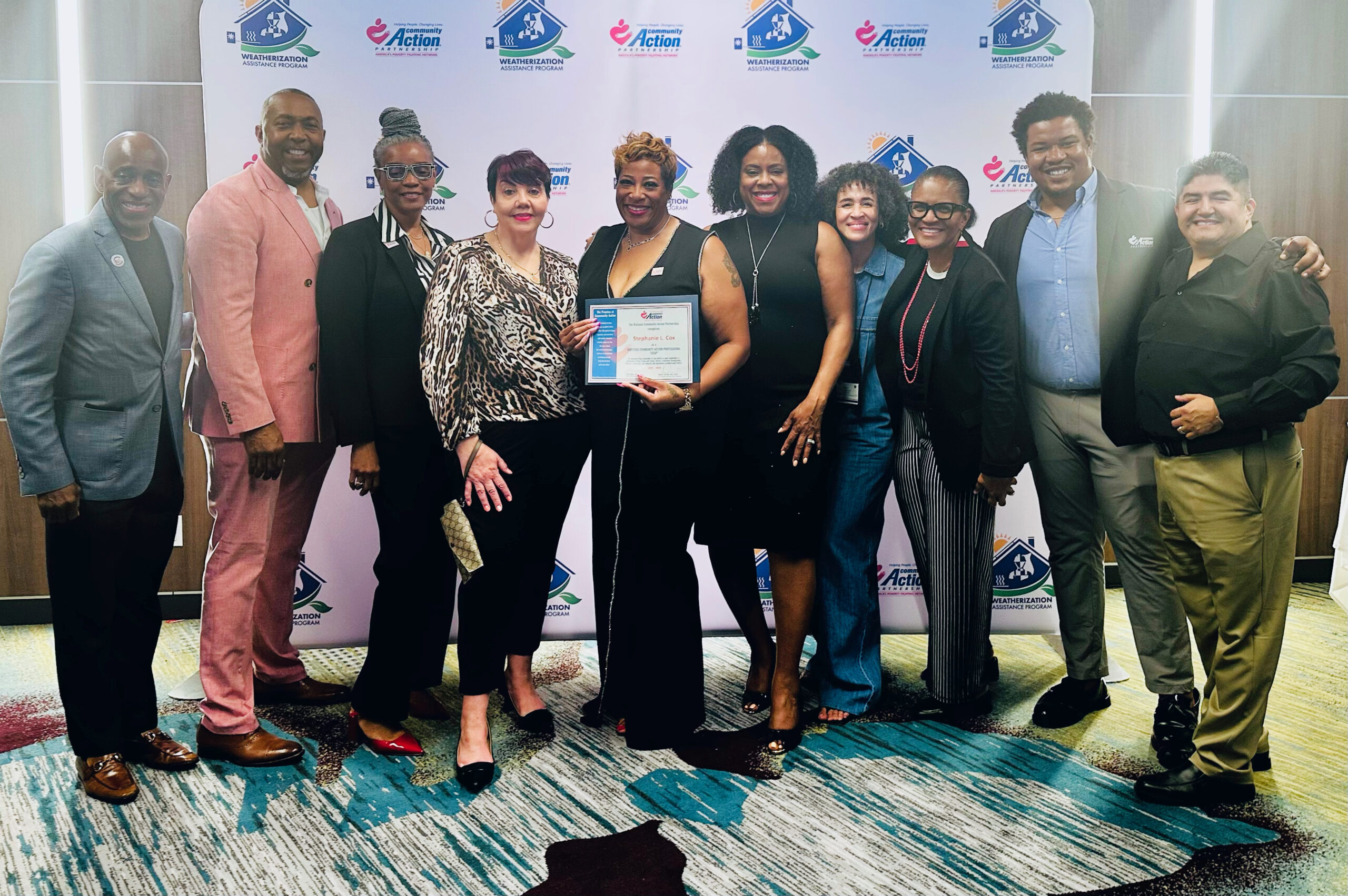 Attendees of CAP CON stand with CCAP Professionals